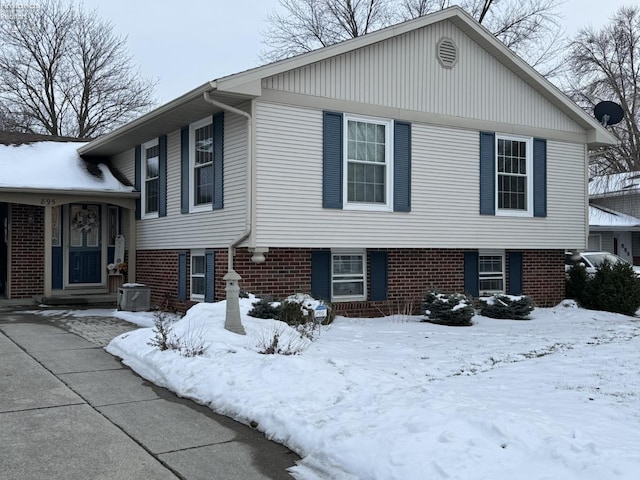 split level home with brick siding