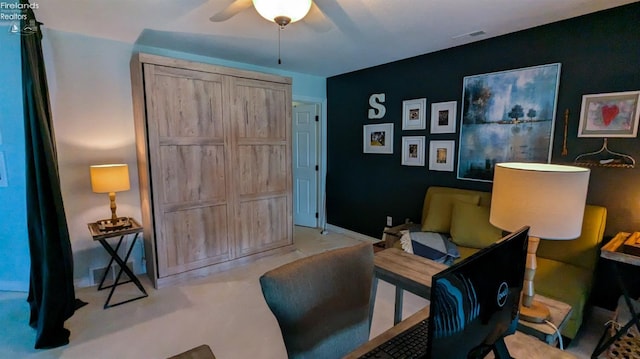 home office with visible vents and a ceiling fan