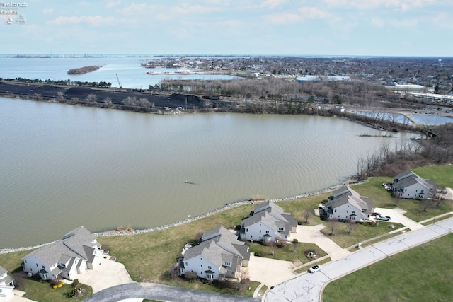 bird's eye view featuring a water view and a residential view