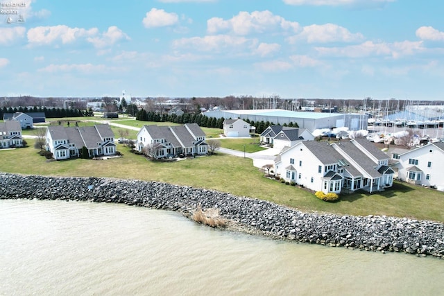 bird's eye view with a water view and a residential view