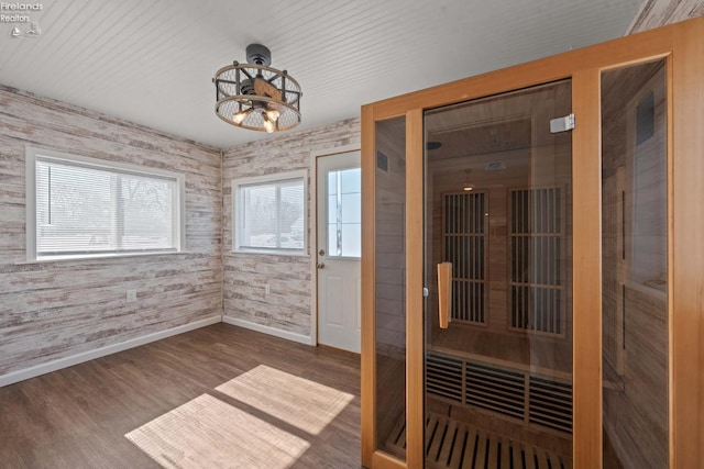 view of sauna featuring baseboards and wood finished floors