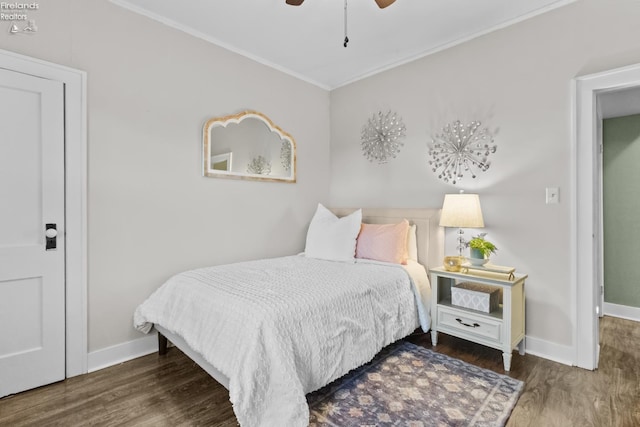 bedroom with ceiling fan, ornamental molding, wood finished floors, and baseboards