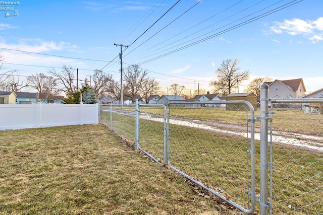 view of yard featuring a gate and fence