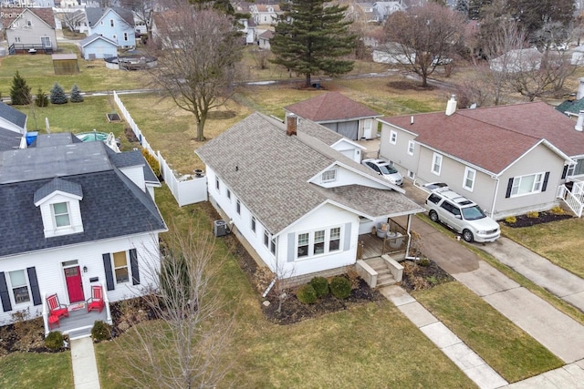 birds eye view of property with a residential view