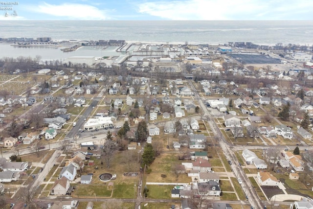 aerial view with a water view and a residential view