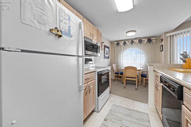 kitchen featuring light tile patterned floors, light colored carpet, light countertops, light brown cabinetry, and white appliances