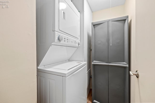 laundry room featuring laundry area and stacked washer and clothes dryer