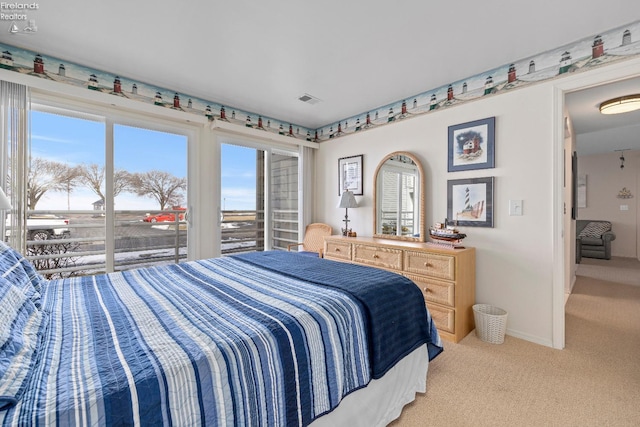 bedroom featuring baseboards, multiple windows, visible vents, and light colored carpet