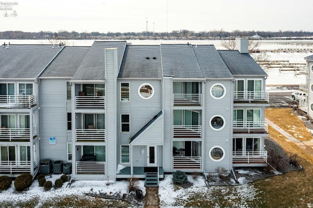 snow covered building featuring central AC