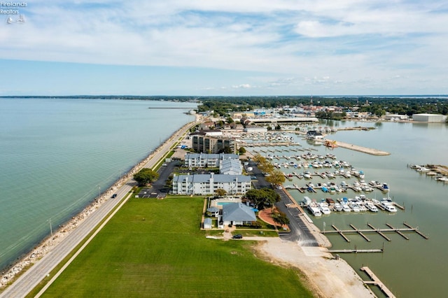 bird's eye view featuring a water view and a beach view