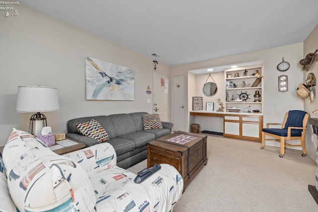 living area featuring light colored carpet