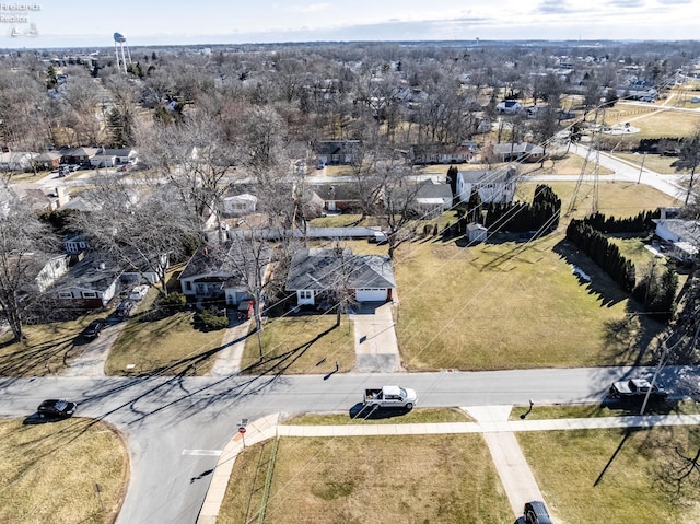 birds eye view of property with a residential view