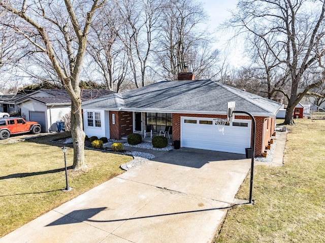 single story home featuring brick siding, a chimney, concrete driveway, an attached garage, and a front yard