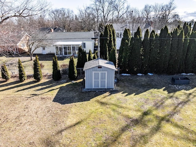 view of yard with a storage shed and an outdoor structure