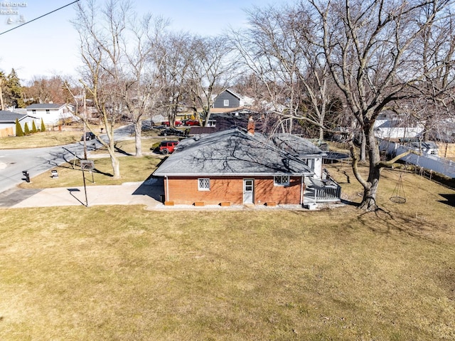 birds eye view of property with a residential view