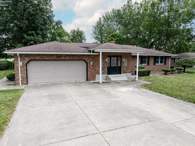 single story home with a garage, concrete driveway, roof with shingles, a front lawn, and brick siding