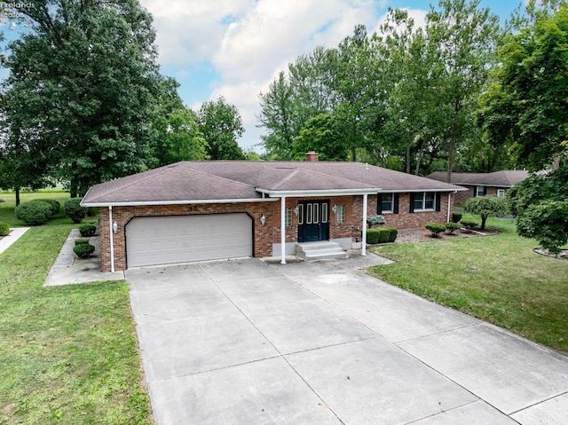 ranch-style home with a garage, brick siding, and a front lawn