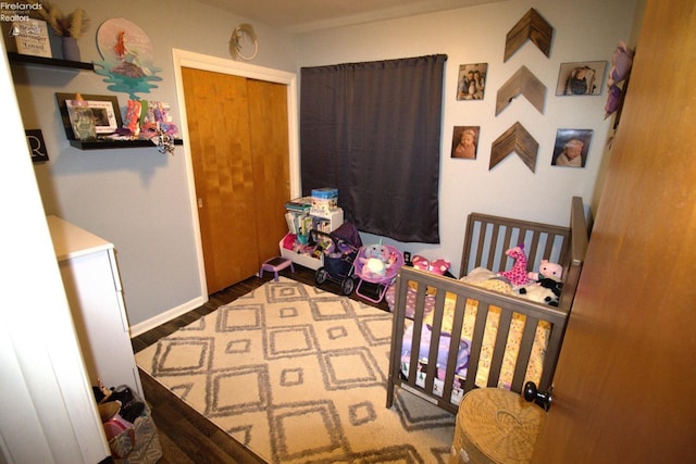 bedroom with a closet and baseboards