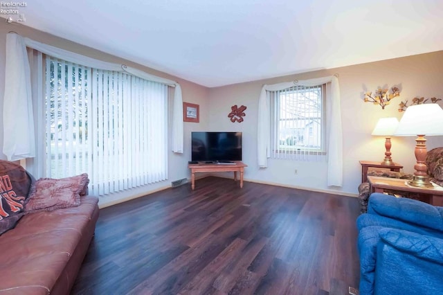 living room featuring wood finished floors and visible vents