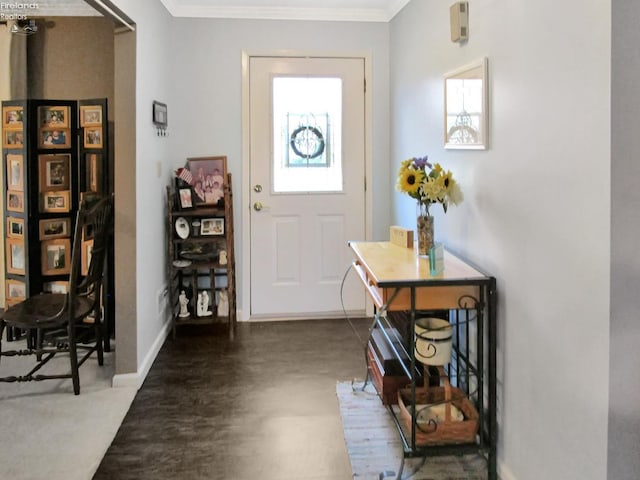 entryway with baseboards and crown molding