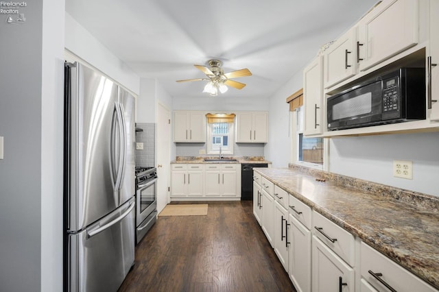 kitchen with dark wood-style flooring, a ceiling fan, white cabinets, decorative backsplash, and black appliances