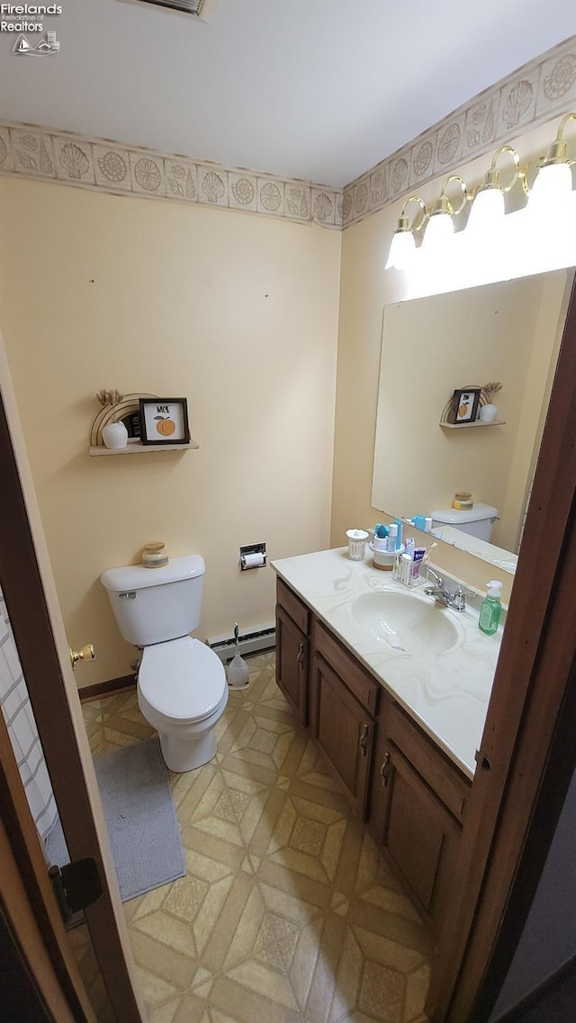 half bath with toilet and vanity