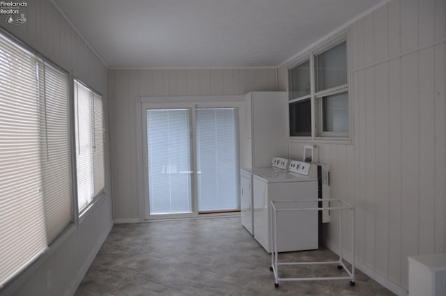 clothes washing area with laundry area and washer and clothes dryer