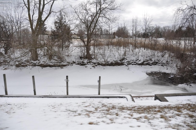 view of yard layered in snow