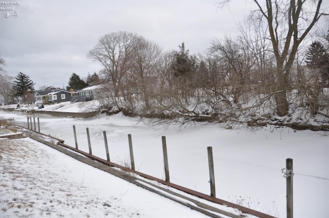 view of yard covered in snow