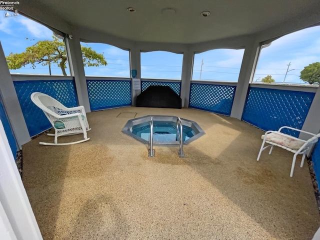 exterior space featuring an indoor in ground hot tub