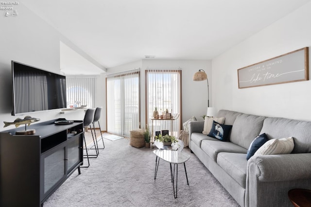 carpeted living room with visible vents