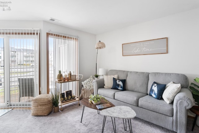 carpeted living room with visible vents