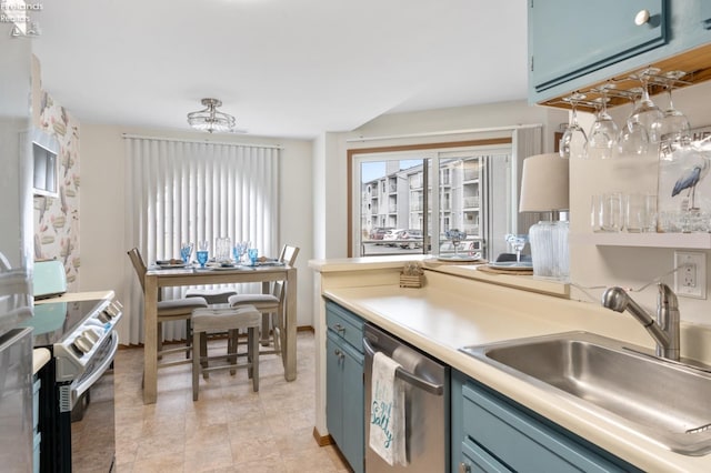 kitchen with blue cabinets, electric range, a sink, light countertops, and dishwasher