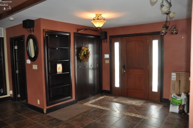 foyer entrance with baseboards