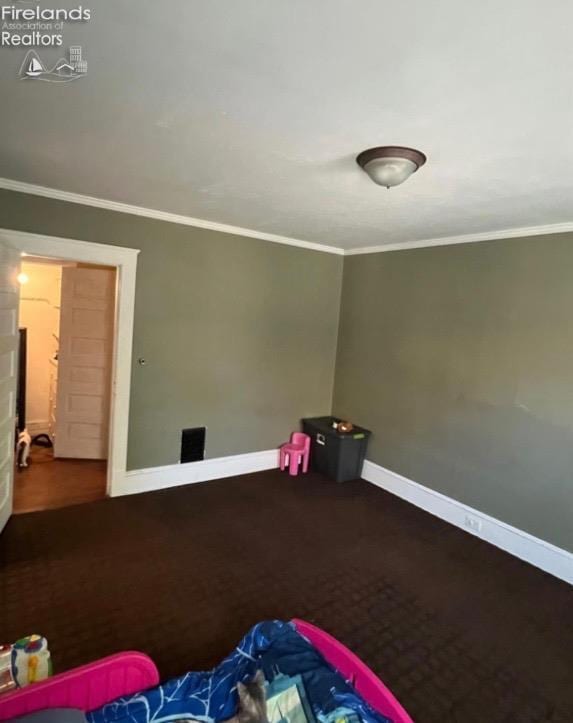 bedroom featuring carpet floors, baseboards, and ornamental molding