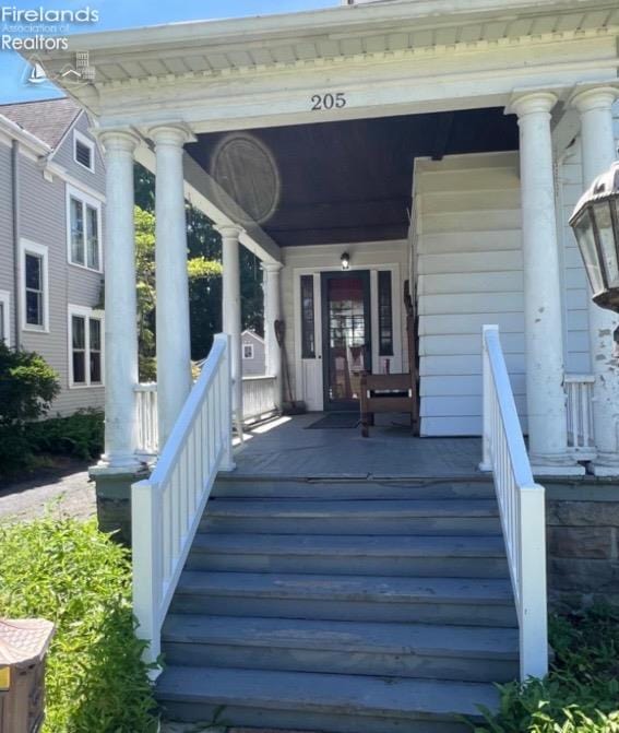 wooden deck featuring covered porch