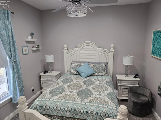 bedroom with baseboards and a ceiling fan