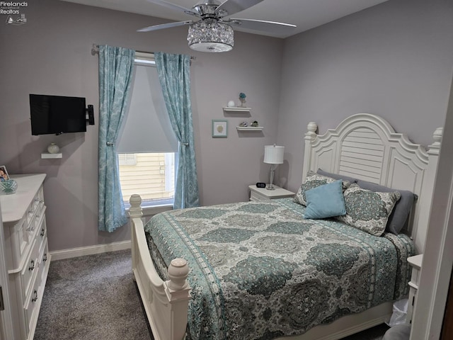 carpeted bedroom featuring baseboards and a ceiling fan