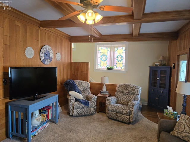 living area with beam ceiling, coffered ceiling, wooden walls, and carpet flooring