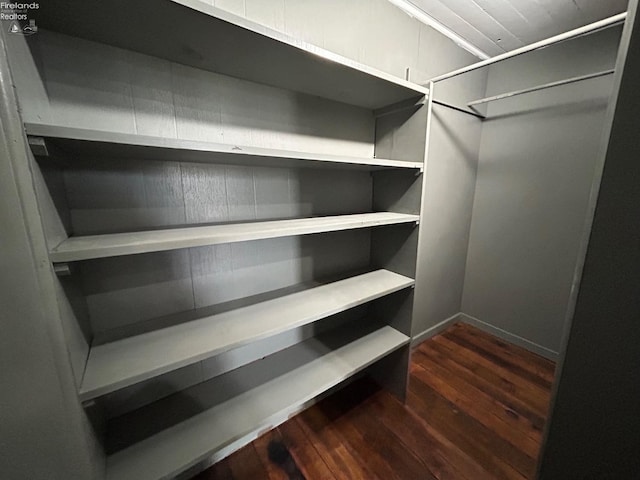 spacious closet with wood finished floors