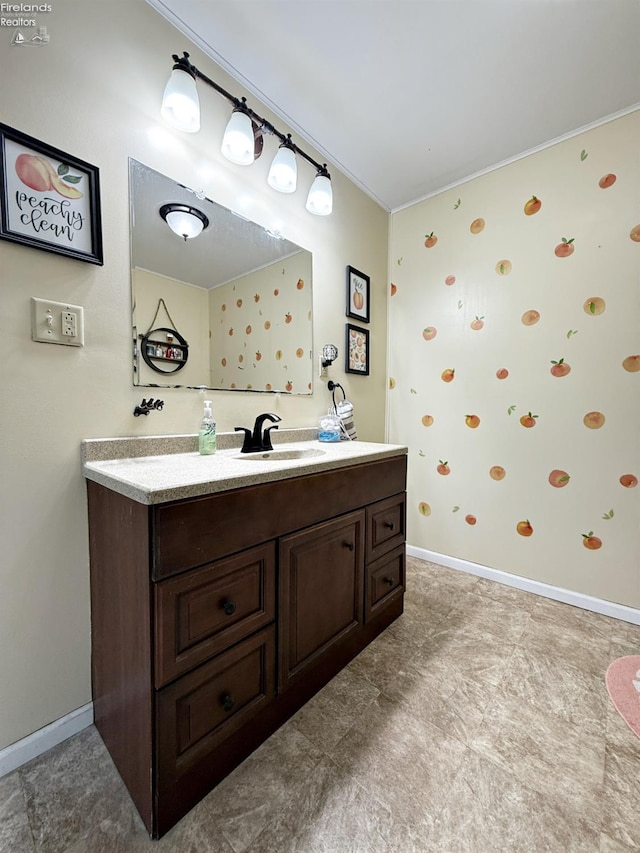 bathroom featuring vanity and baseboards