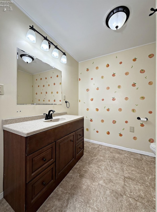 bathroom with baseboards and vanity