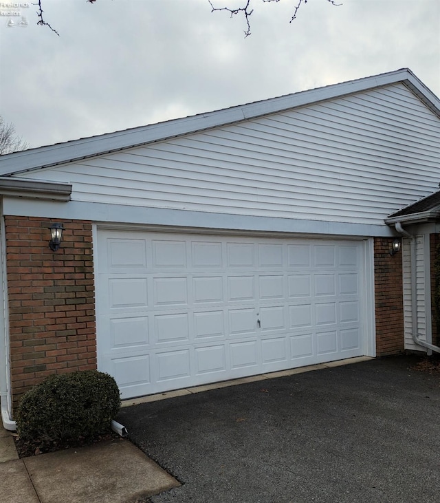 garage featuring driveway