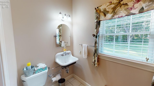 1876 N Lakewood Ave, Port Clinton, OH 43452 - bathroom featuring baseboards, toilet, and tile patterned floors