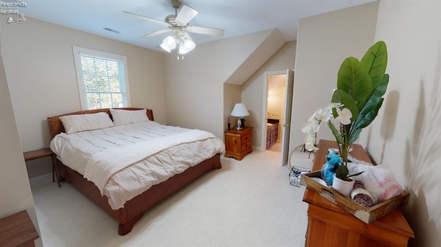 1876 N Lakewood Ave, Port Clinton, OH 43452 - bedroom with a ceiling fan, visible vents, connected bathroom, and light carpet