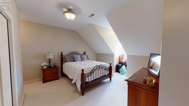 1876 N Lakewood Ave, Port Clinton, OH 43452 - bedroom with lofted ceiling, baseboards, visible vents, and light colored carpet