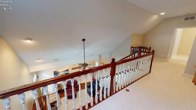 1876 N Lakewood Ave, Port Clinton, OH 43452 - hall featuring baseboards, visible vents, lofted ceiling, carpet flooring, and an upstairs landing