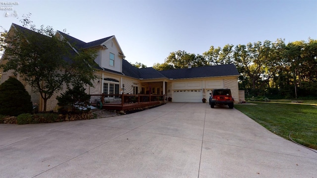 1876 N Lakewood Ave, Port Clinton, OH 43452 - view of front of property with a garage, driveway, and a front lawn