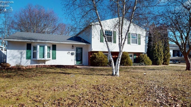 split level home featuring a front yard