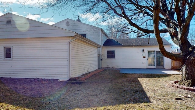 view of property exterior featuring a patio area